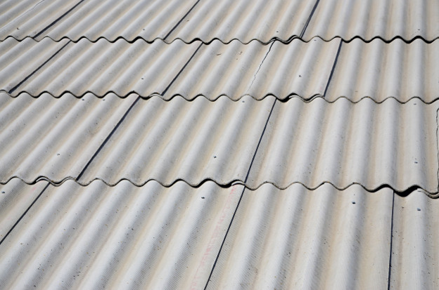 Old slate roof tiles that need replacing.