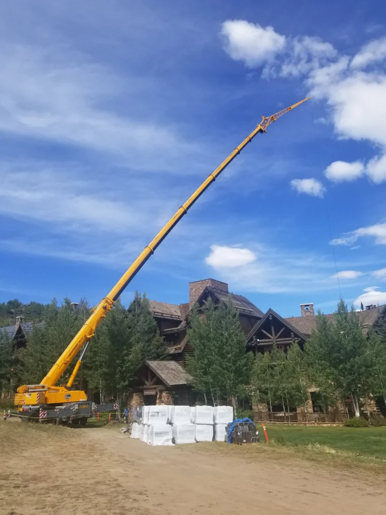 Crane installing CEDUR roofing at The Timbers with Horn Brothers Roofing.