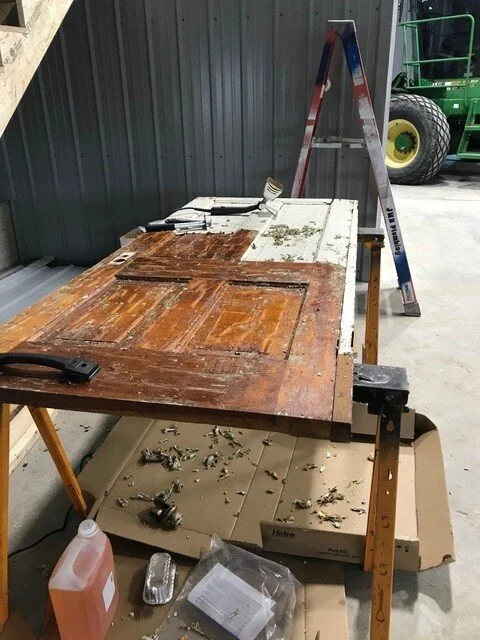 Refinishing a historic door. 