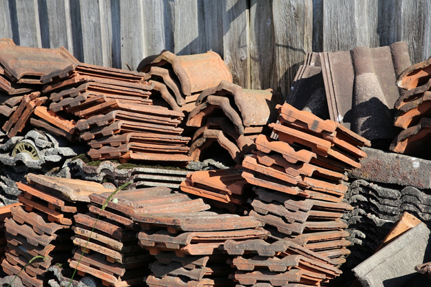 Concrete tile roof requiring regular maintenance and upkeep.