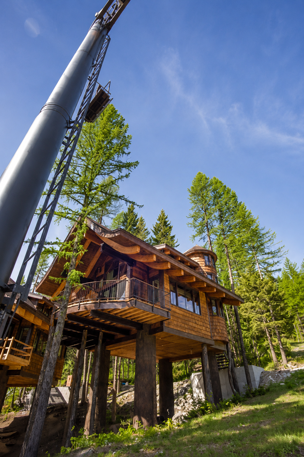 Snow-covered chalet construction project beneath a ski lift.