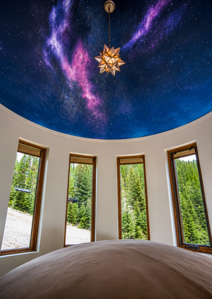 Interior treehouse-style view at Snow Bear Chalets overlooking Whitefish Mountain Resort, Montana.