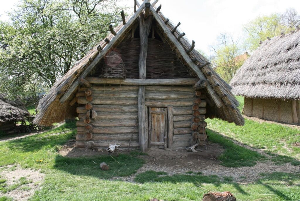 Old wooden log cabin structure with a rustic exterior.