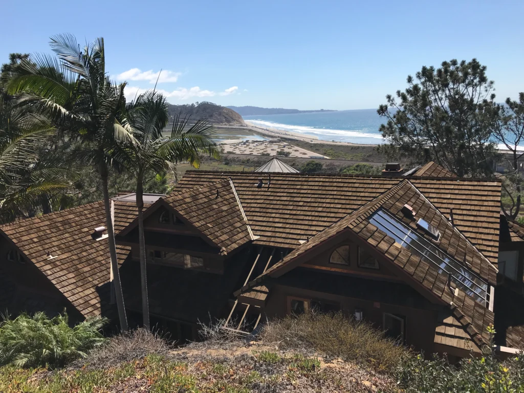 A CEDUR synthetic roof on a house in a  tropical setting. 