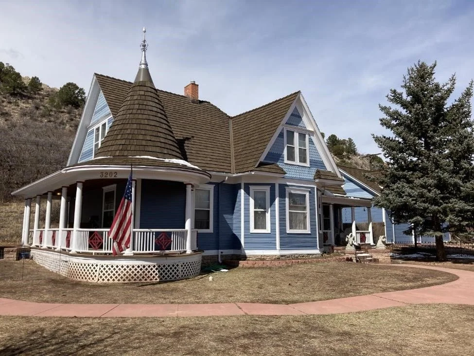 A gable style roof with a tower design.