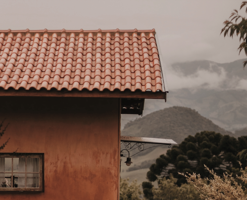 A close up look at a tile roof on a house.