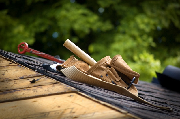 An image of roofers tools on a residential roof.