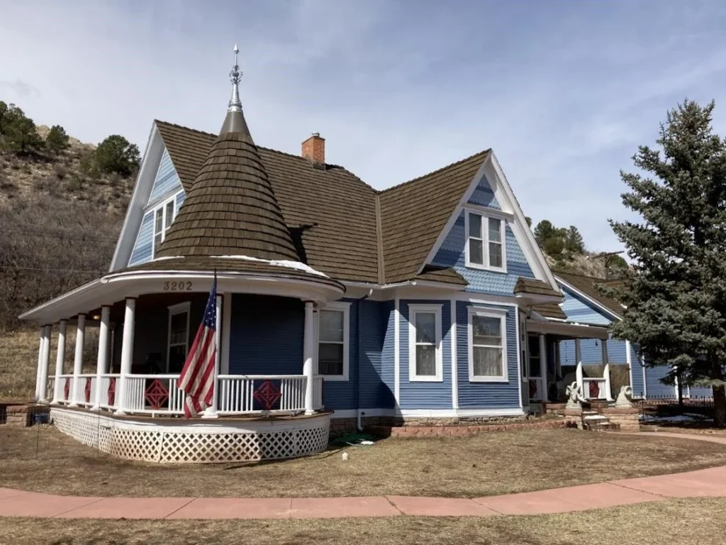 A pitched roof with snow on the top on a Colorado home.
