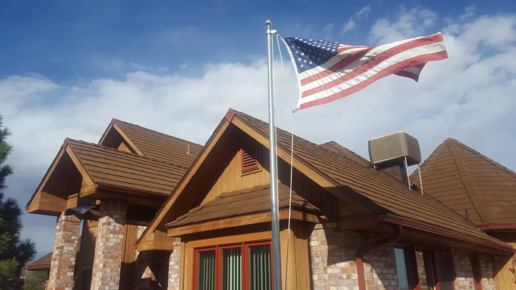 Modern residential home topped with CEDUR synthetic roofing.