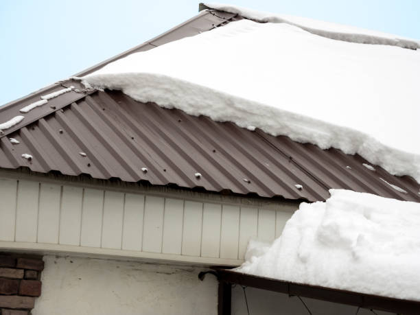 Metal roof covered with a layer of snow during winter.
