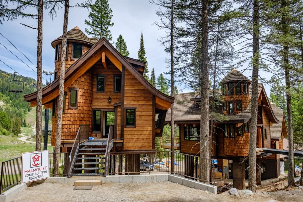 Snow Bear Chalets beneath a ski lift in a mountain setting.