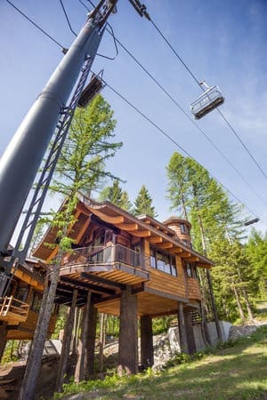 Snow Bear Chalets beneath a ski lift in a mountain setting.