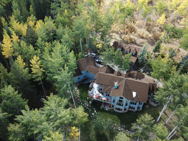Arial view of a home in the mountains.