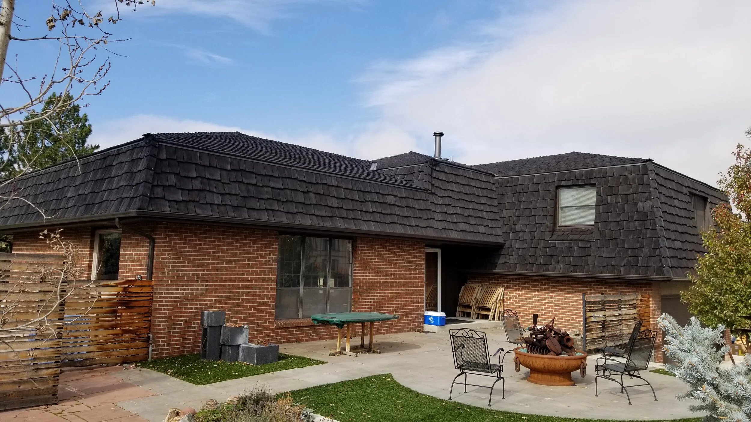 Cedar Shakes paired with brick siding.
