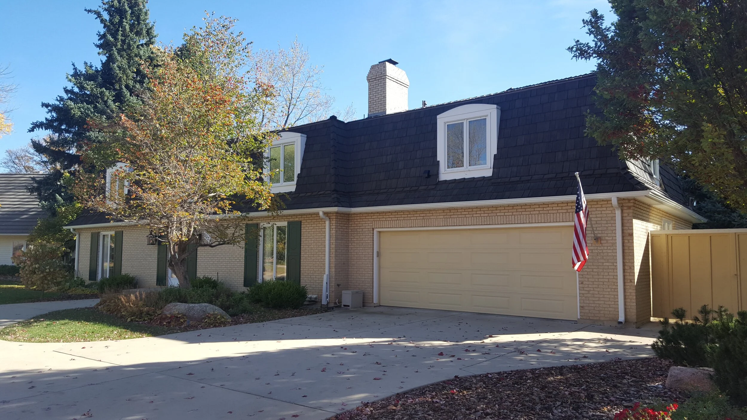 A home with dark shake shingles.