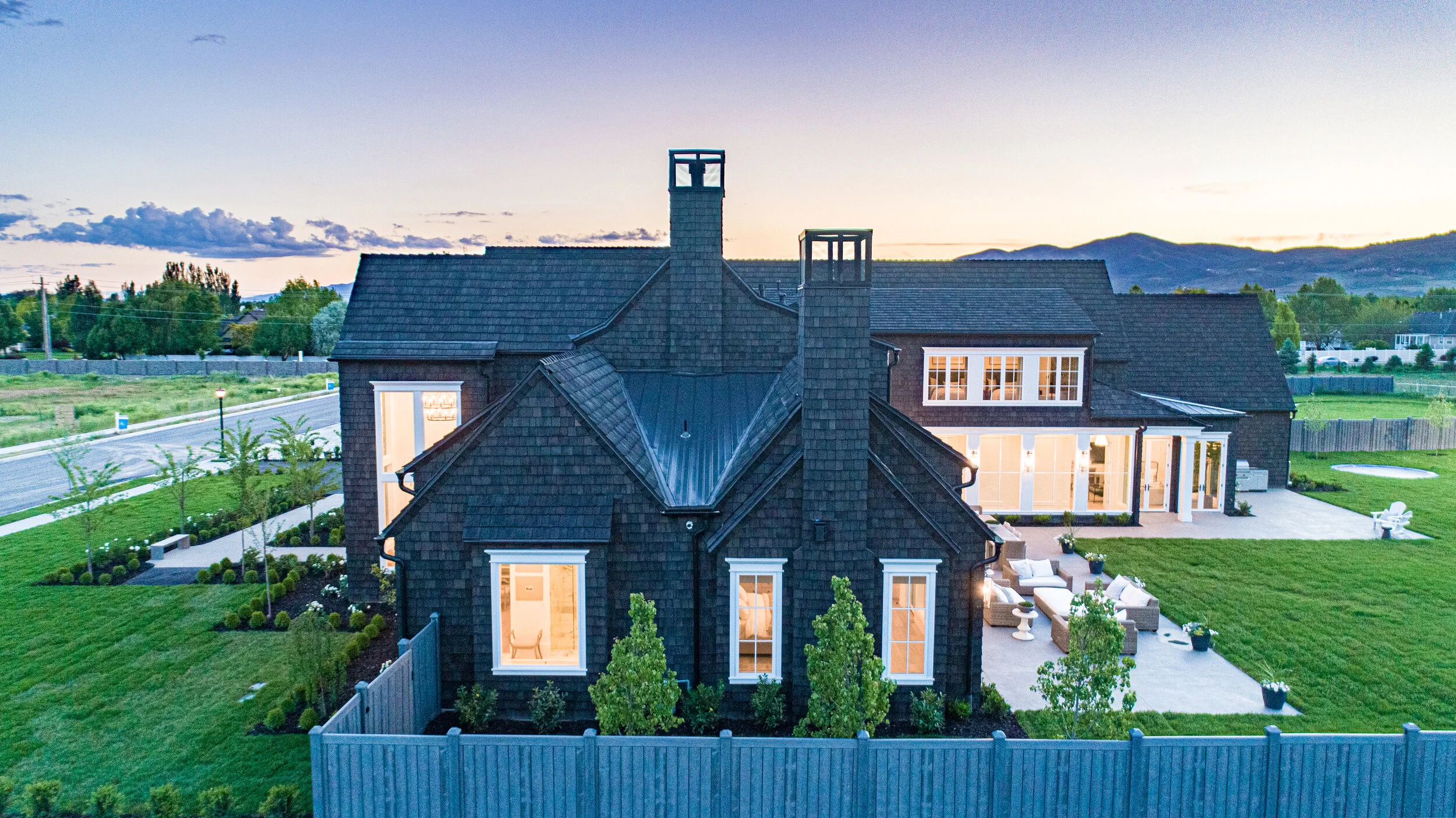 A mountain home covered in shake shingles.