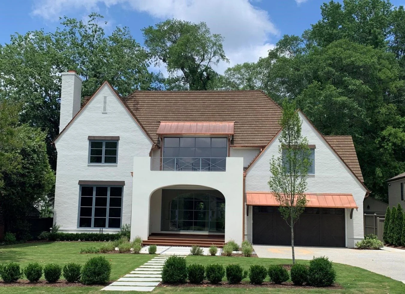 Cedar shakes paired with a light colored home siding.