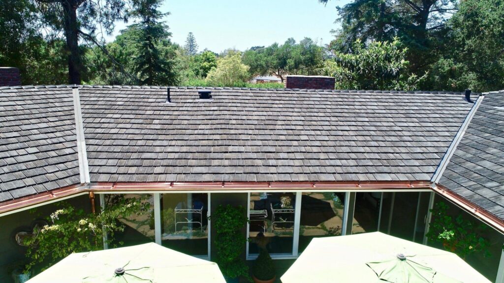 Contemporary home with maintenance-free synthetic cedar shake roofing.