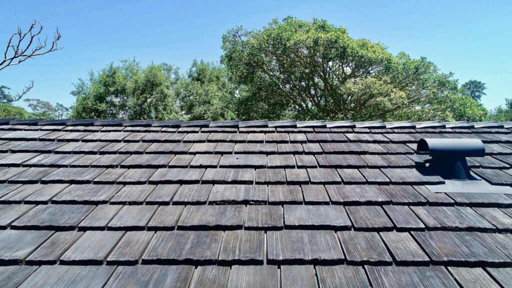 Synthetic cedar shake roof adding warmth and character to home exterior.
