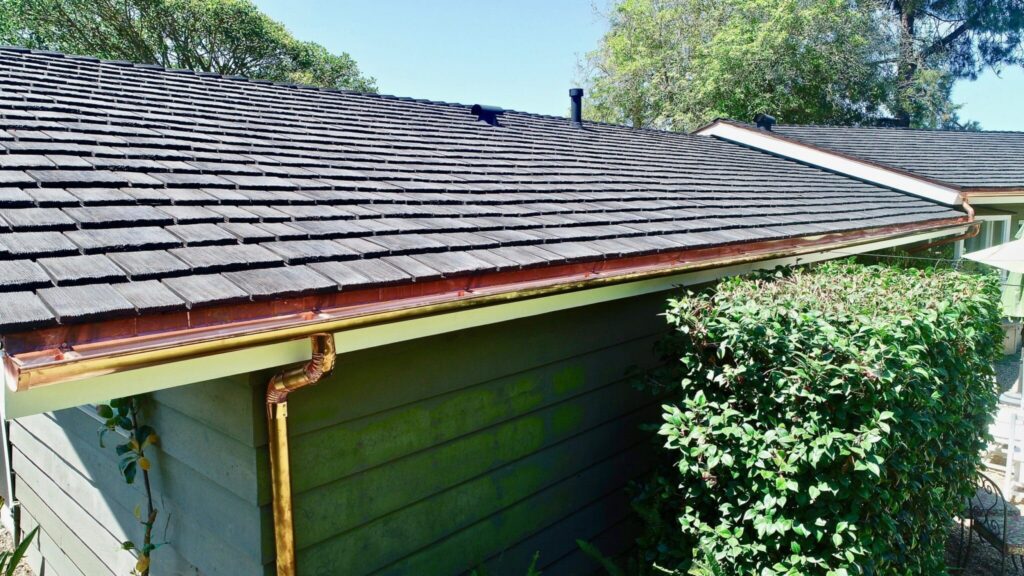 Durable synthetic cedar shake roofing system on upscale property.