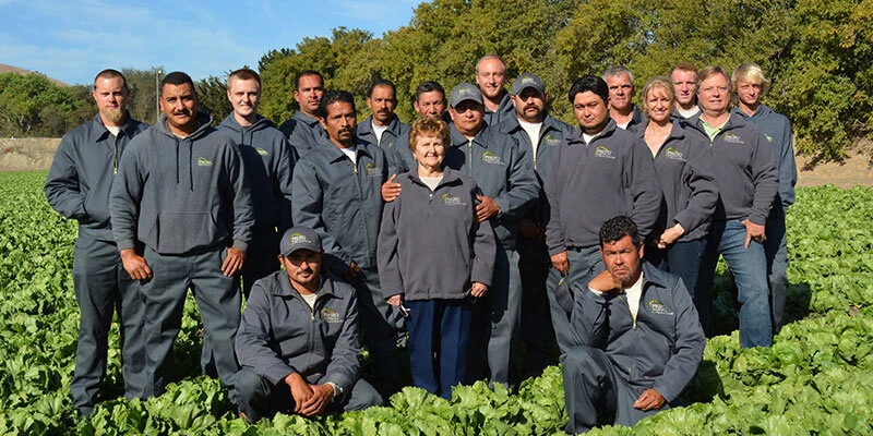 Smiling faces of the roofing crew at Premo Roofing in California.