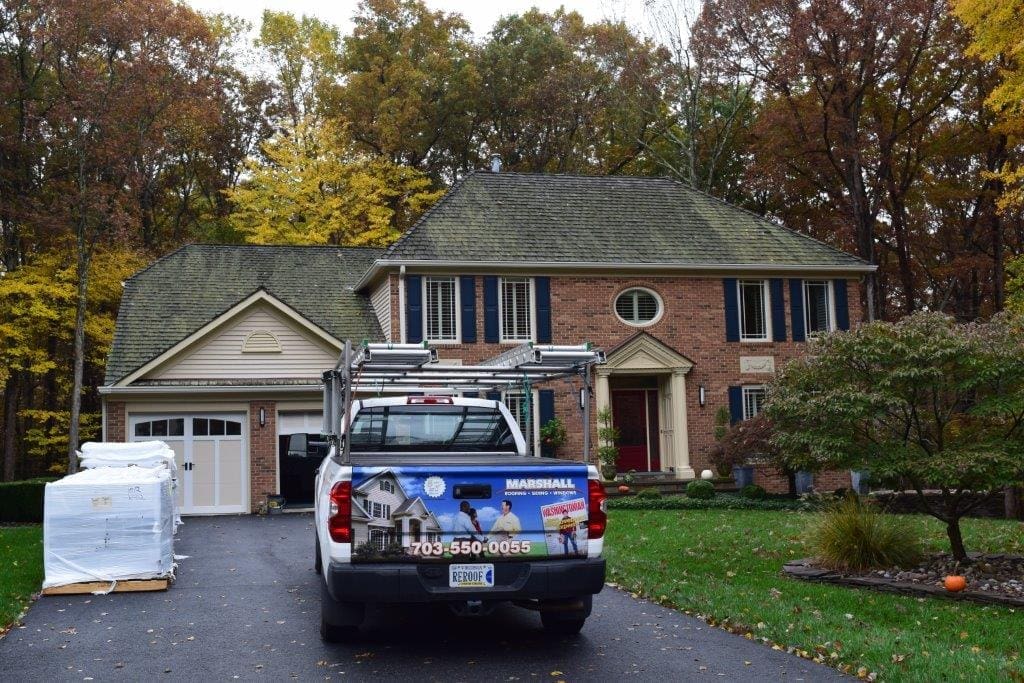 Contemporary home with maintenance-free synthetic cedar shake roofing.
