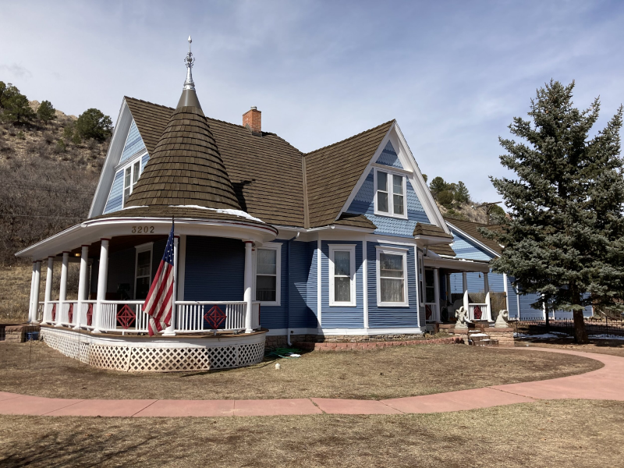 CEDUR Walden roof on a blue Victorian-style home in Colorado Springs, Colorado, installed by RoofWorx.