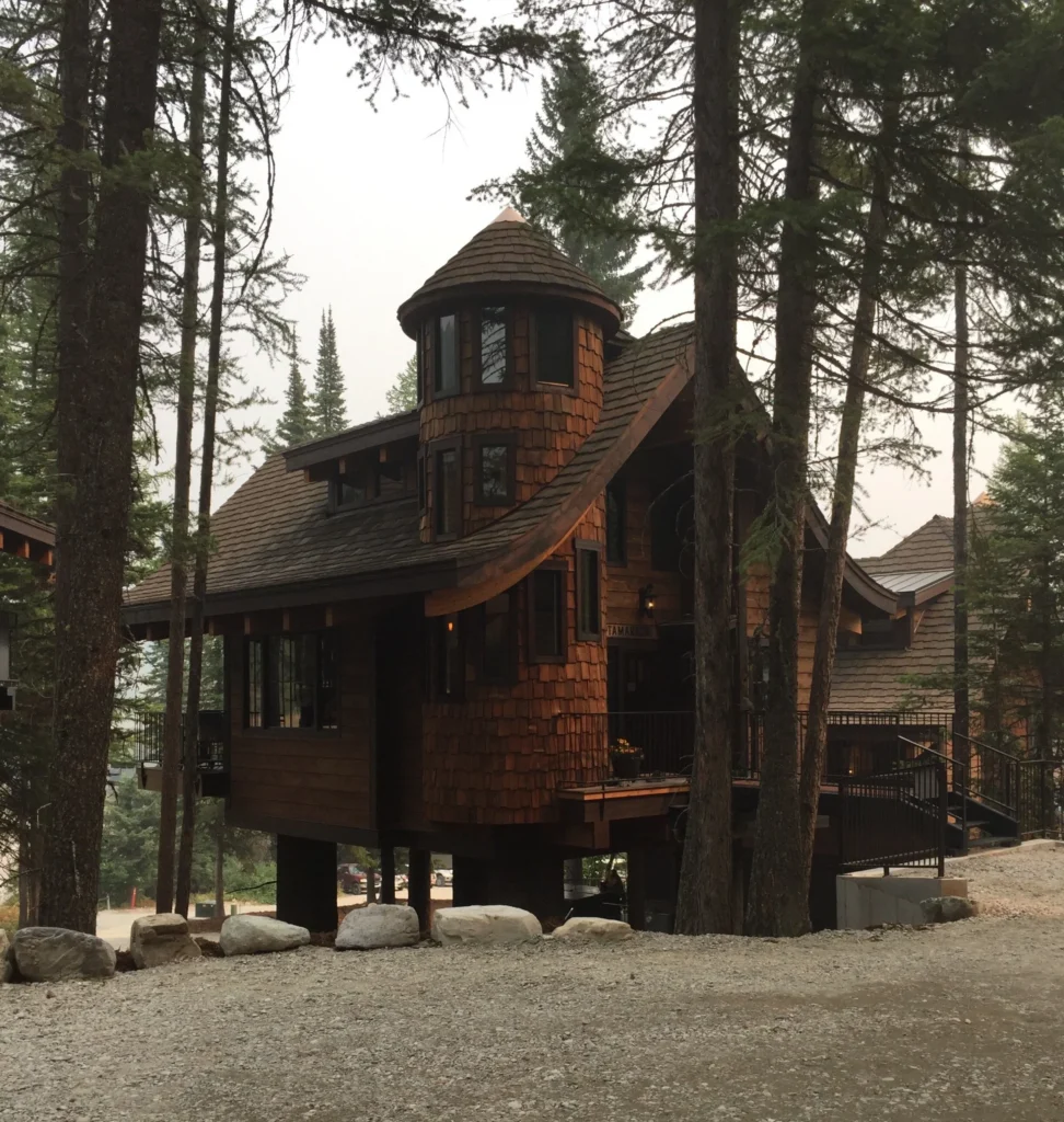 A unique mountain home with a rustic home exterior.