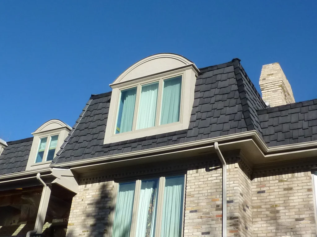 Synthetic cedar shake siding.